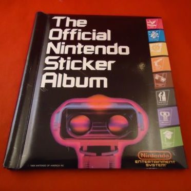 Black Nintendo sticker album with ROB on the cover